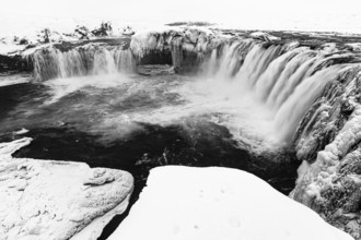 Godafoss waterfall, icy and snowy rock face, black and white photo, Northern Iceland Eyestra,