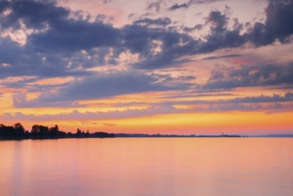 Church and harbour of Romanshorn in the evening light, view from Arbon over Lake Constance