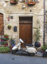 Vespa scooter in the streets of Assisi Old Town, Umbria, Italy, Europe