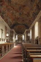 Interior view of Romanesque Mother of God Parish Church with ceiling painting in Aschaffenburg,