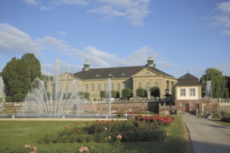 Rose Park with water fountain and UNESCO Regentenbau in Bad Kissingen, Rhön, Lower Franconia,