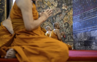 Buddhist monks at prayer, Wat Pho, Temple of the Reclining Buddha, Bangkok, Thailand, Asia