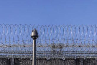 Stammheim prison, JVA. Exterior view with security fence and surveillance camera. Stuttgart,