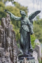 Angel with rose and palm frond, Nordfriedhof, Ungererstr., Munich, Upper Bavaria, Bavaria, Germany,