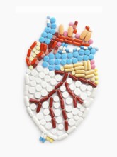 Drugs and pills in the shape of a human heart