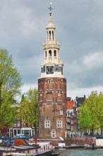 Tower (Montelbaanstoren) on the Bank of the Canal Oudeschans in Amsterdam, Netherlands Amsterdam,