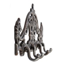 Antique metal hanger. Isolated picture