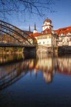 Waasenbrücke and Schwammerlturm, historic old town ensemble reflected in the river Mur, Leoben,