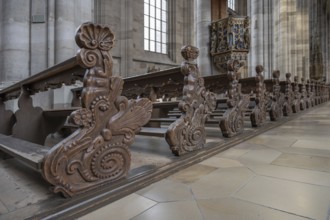 Cheeks of the pews in the late Gothic hall church of St George, Dinkelsbühl, Bavaria, Germany,