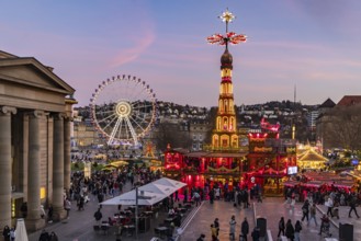 Stuttgart Christmas market at the blue hour. Christmas pyramid on Schlossplatz in front of the New