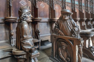 Figures on the late Gothic choir stalls from 1507, St Martin, Memmingen, Bavaria, Germany, Europe