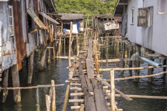 Wooden bridge in the fishing village of Ban Ao Salad, Ko Kut Island or Koh Kood Island in the Gulf