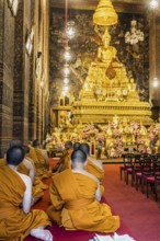 Wat Pho temple in Bangkok near the Grand Palace. Buddhist monks during a religious ceremony.