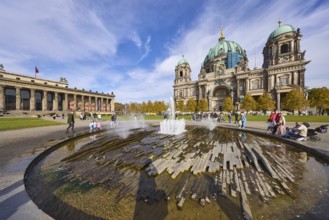 Fountain in the Lustgarten, Altes Museum and Berlin Cathedral under a blue sky with cumulus and