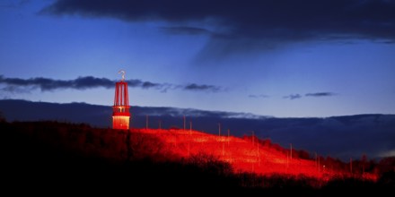 Artwork Illuminated at night with red illuminated slagheap Rheinpreussen by Otto Piene, Moers, Ruhr