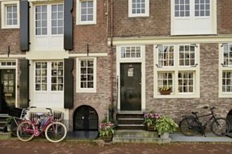 Bicycles in front of historic buildings, Herengracht 43, Amsterdam, Province of North Holland,