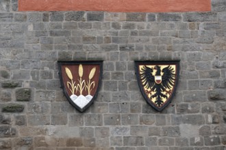 Spelt and imperial eagle in the coat of arms at the Wörnitz Gate, Dinkelsbühl, Bavaria, Germany,