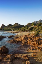 Lonely picturesque beach and red rocks, Spiaggia Su Sirboni, sunrise, near Tertenia, Province of