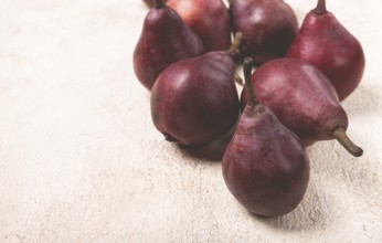 Red pears scattered on the table, barletta pear, selective focus, no people