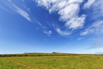 Green meadow, edge of cliff on the horizon, cumulus clouds, cirrus, Kerry Cliffs, panoramic road