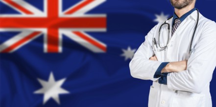 Male Doctor holding stethoscope on Australian flag. Doctor with stethoscope on Australia flag