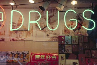 Drugs, illuminated advertisement in a shop window, New York City, USA, North America