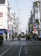 Tram and people on Leidsestraat, Amsterdam city centre, Netherlands