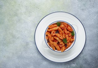 Penne pasta, with shrimp in tomato sauce, close-up, no people