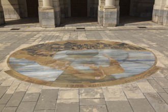 1908-2008 commemorative round marble design with motifs inlaid in paving stones in front of