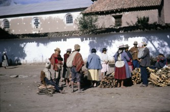 Local people buying firewood at the Calca street market, Cusco region, Peru, South America, 1962