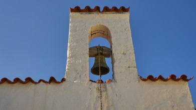 Close-up of a bell tower with a bell under a blue sky, Agios Ioannis church, Mesochori village,