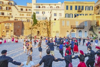 Group of people performing traditional Greek dance, Chania, Crete, Greek Islands, Greece, Europe