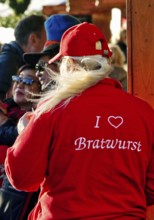 I love Bratwurst, print on the red clothing of a saleswoman at the Christmas market, Düsseldorf,