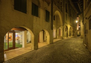 Arcades in Asolo at night, province of Treviso, Italy, Europe