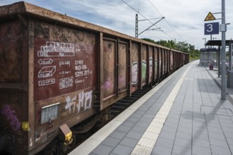 Goods train passes through the railway station in Haßfurt, Lower Franconia, Bavaria, Germany,