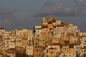 Close-up of colourful buildings on a hill at sunrise, Colourful mountain village, Morning light,