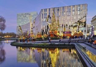 Dreischeibenhaus and Christmas market in front of the Koe-Bogen by architect Daniel Libeskind,