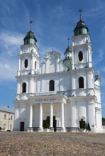 Historic baroque church with twin towers, under a clear sky, Basilica of the Nativity of the Virgin