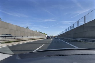 Driving on the A73 motorway with noise barriers on both sides, Bavaria, Germany, Europe