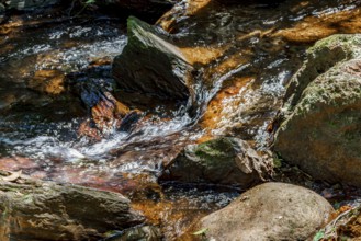 Water from a small river flowing between rocks in Minas Gerais Minas Gerias, Brazil, South America