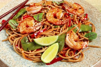 Fried udon noodles with shrimp and vegetables, Asian cuisine, homemade, no people