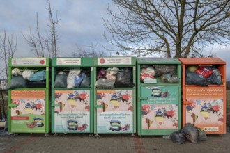 Overfilled clothes containers in a car park, Eckental, Middle Franconia, Bavaria, Germany, Europe