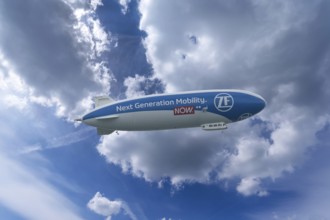 Zeppelin as an advertising medium in the cloudy sky over Rottweil Baden-Württemberg, Germany,