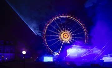 Night shot, rehearsal for New Year's Eve party, theatre, laser show, light show, Ferris wheel,