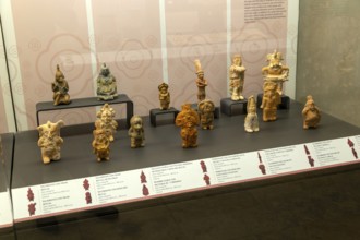 Display case of ceramic figurines from Jaina, Late Classic Period, Mayan archaeological museum,