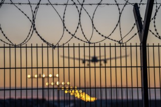 Symbolic image security at the airport, outer fence at Düsseldorf International Airport, steel wire