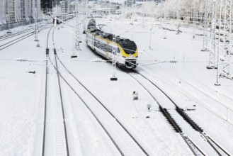 Tracks and train covered with snow and ice, Freiburg im Breisgau, Black Forest, Baden-Württemberg,