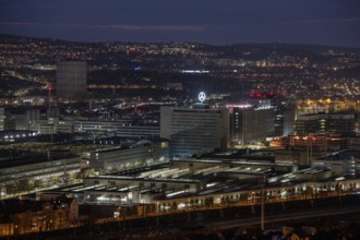 Urban nightlife with illuminated industrial buildings and city lights, Mercedes Benz,