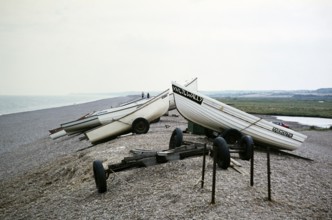 Fishing spots on the shingle ridge on the beach at Cley, Norfolk, England, UK undated ca. 1970s