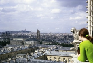 People looking at the city from Notre Dame Cathedral, Notre Dame, Paris, France, 1970, Europe